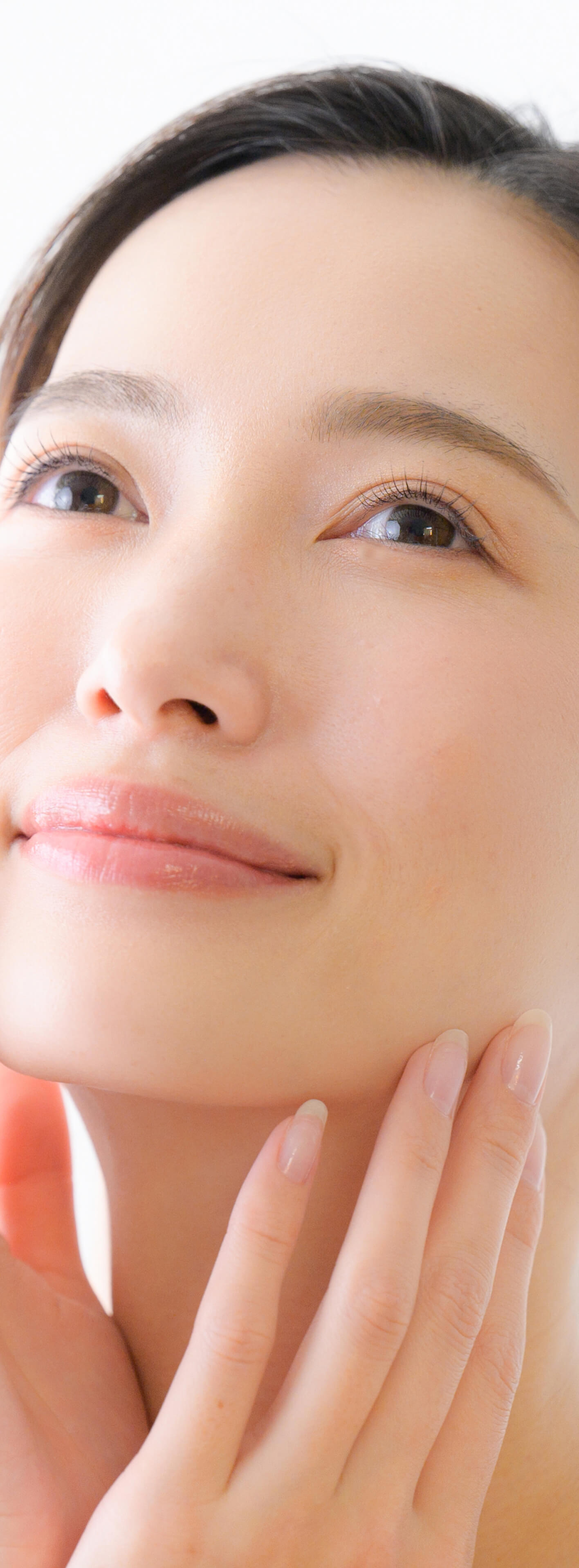 Photo of a woman touching her face